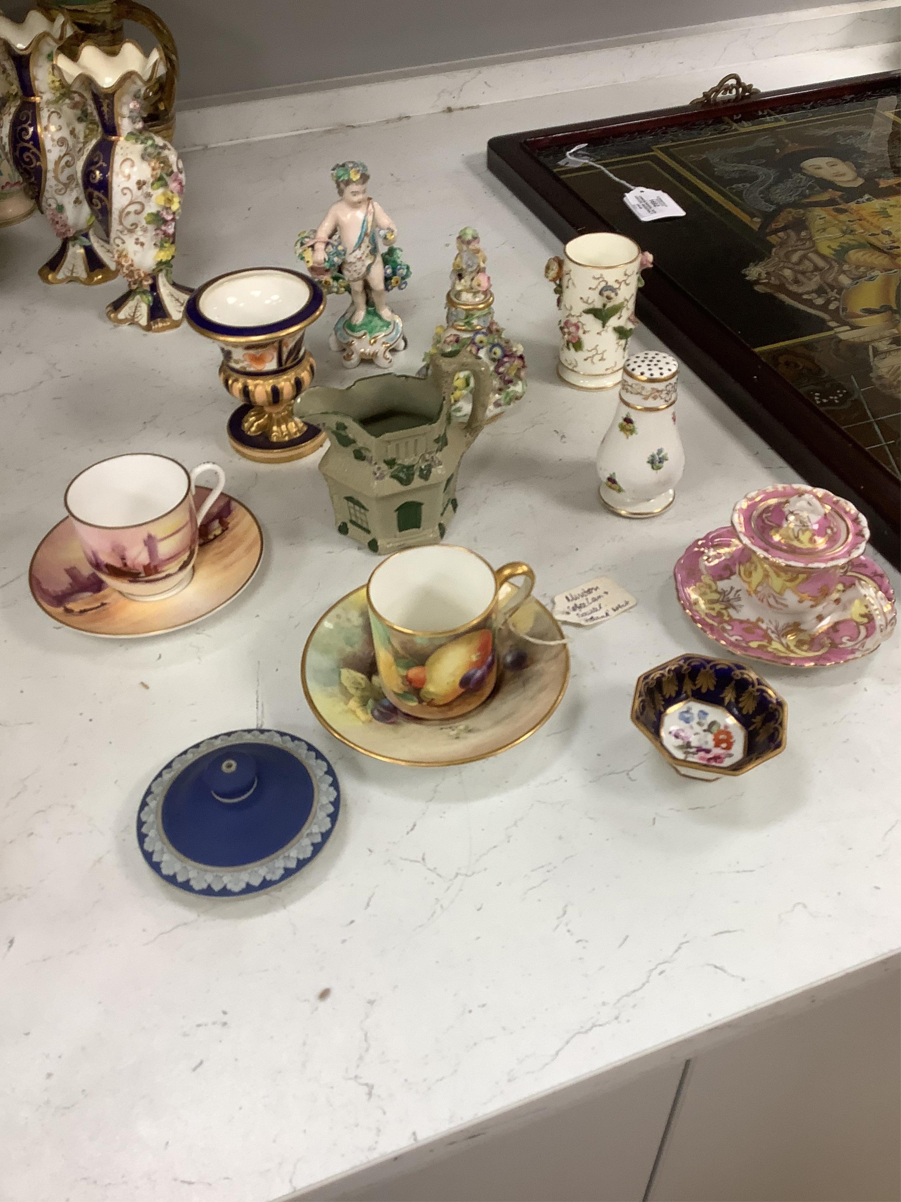 Large group of 19th/20th century English ceramics, to include a Rockingham basket, other English porcelain flower encrusted vessels, a Copeland and Garrett ewer, a Minton Sevres style beaker, a Wedgwood agate ware jug, R